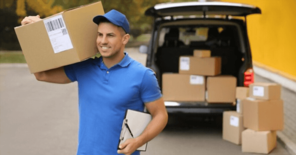 Parcel delivery made easy with a man in a blue shirt holding a box next to a van.